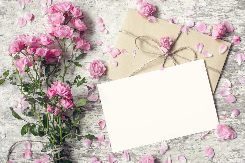 Blank white greeting card and envelope with pink rose flowers